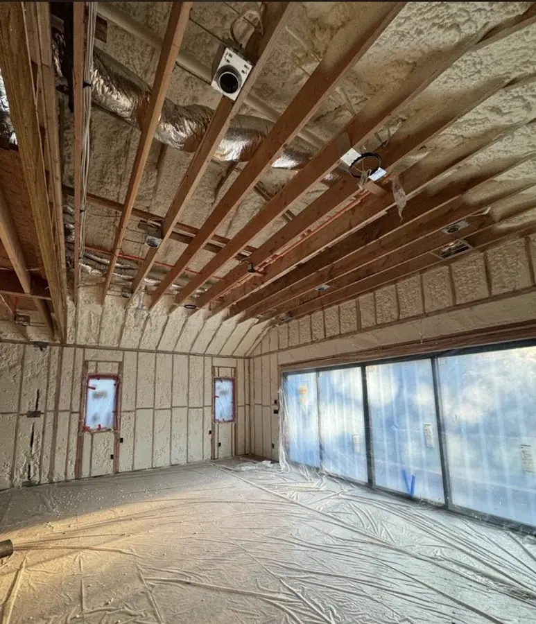 Interior walls and ceiling insulated with spray foam during new construction in Gateway